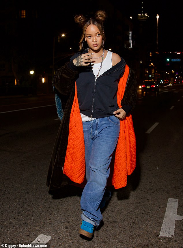 Rihanna showed off her famous fashion sense Thursday night when she stepped out solo in Los Angeles