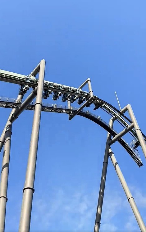 Terrifying footage shows 32 passengers dangling upside down after the Flying Dinosaur roller coaster at Universal Studios Japan in Osaka broke down mid-ride today