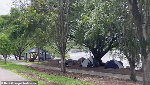 Images from the Brisbane River waterfront show a growing tent city of homeless people amid housing and cost of living crises (pictured)