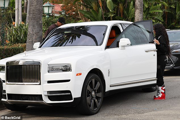 The Icy Girl rapper, 30, parked her white Rolls Royce, in which YG, 33, was a passenger