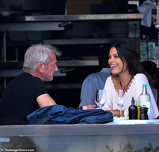 Sean Penn kicked off his weekend Friday with a relaxing lunch date with actress Nathalie Kelley at a beachside restaurant in Miami, Florida