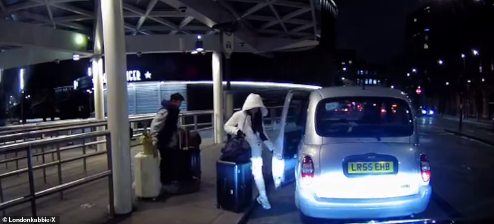 The couple arrive at a taxi rank outside London's Kings Cross station