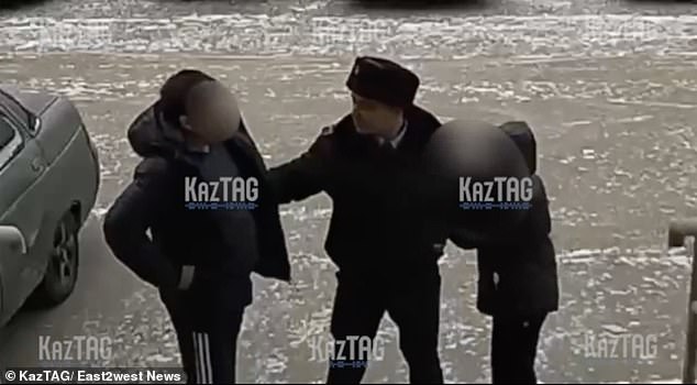 Police officer Rymgali Zhibraev (center) saves a child (right) from a suspected sex offender (left)