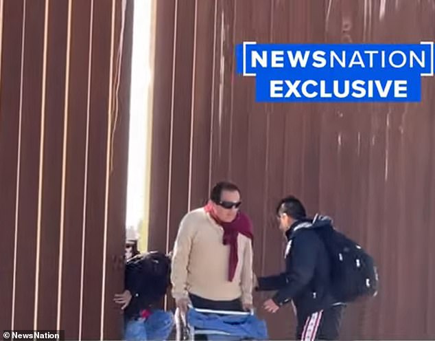 The older man with one leg gripped his walker for support as he squeezed through the small gap.  He was followed closely by a family of five who said they were all from Peru