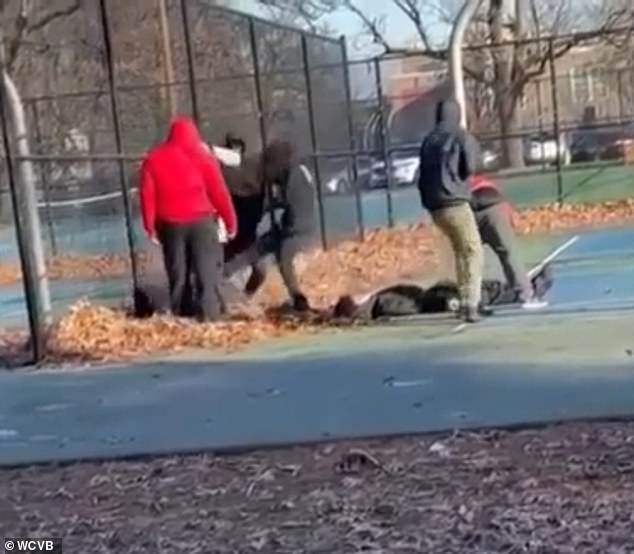 Disturbing footage showed nine youths stamping and kicking a child as he lay helpless on the ground