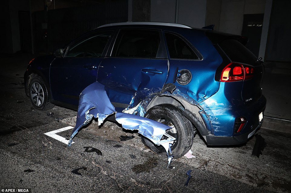 The Kia parked along the road was also left a mangled mess in the wreckage