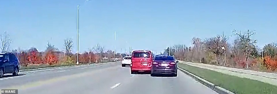 Dashcam footage shows Henkle's red van cutting off Mozee's car as it swerves from the center lane into the right lane