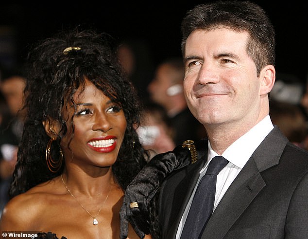 Gift: Sinitta with her children's godfather Simon Cowell says she's glad she let him pay for their private education