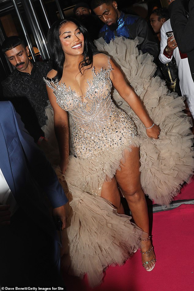 Stefflon made quite the entrance and had her big dress train carried by a friend as she got ready for photos on the red carpet