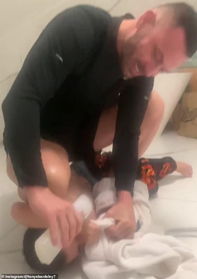 Shock: Earlier this week the couple suffered a blow when ex-Manchester United player Phil was spotted pretending to wash his son's mouth with shampoo because he was swearing