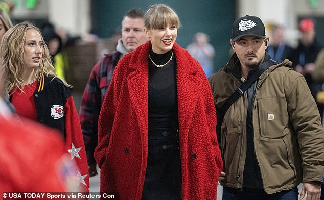 Taylor Swift, 33, and Brittany Mahomes, 28, further cemented their BFF status when the pop singer borrowed a red teddy coat from Patrick Mahomes' wife while cheering on Travis Kelce in Green Bay on Sunday.