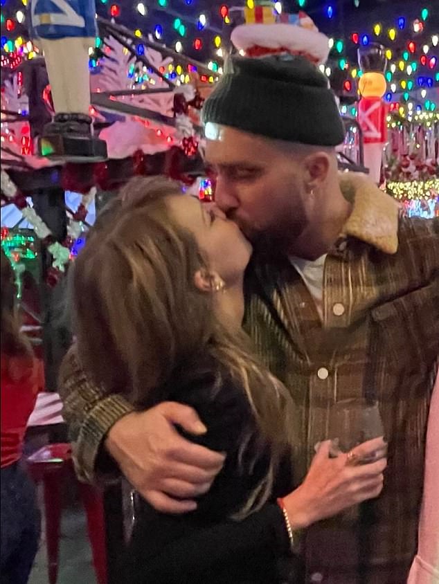 A new photo has surfaced of Taylor Swift and Travis Kelce kissing on the lips