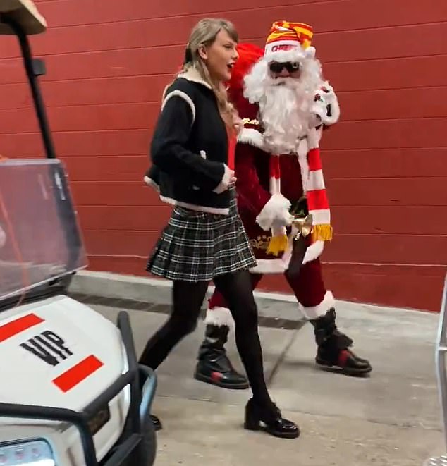 Taylor Swift is driven into Arrowhead Stadium on a golf cart