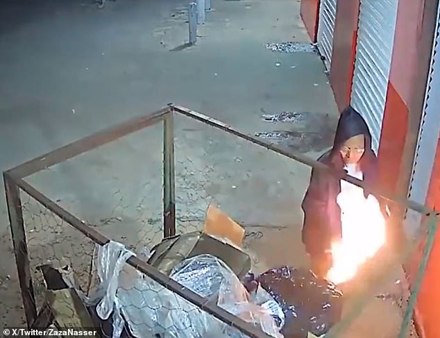 A 39-year-old woman was caught on camera in Brazil setting fire to a garbage bin on Sunday evening before the flames engulfed a shop next door