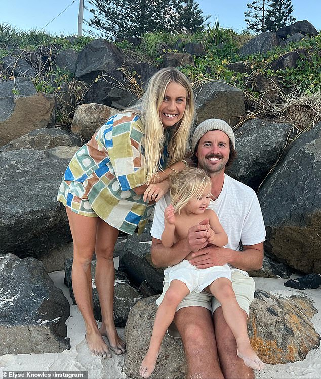 Josh Barker, 30, proved on Sunday he would do anything for the perfect family photo when he threw his eldest child Sunny, two, incredibly high into the air.  Both pictured with partner and mother Elyse Knowles