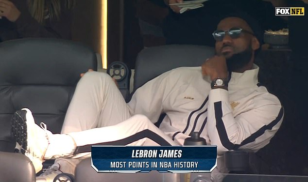 LeBron James was spotted lounging in a white tracksuit during an NFL game on Sunday