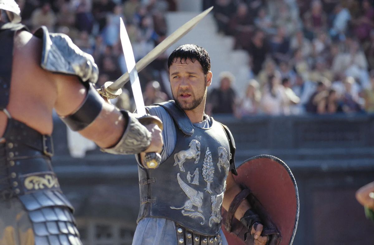 Russell Crowe as General Maximus Decimus Meridius who crosses swords with a gladiator in Gladiator.