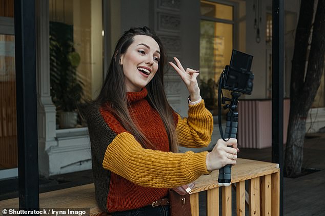 People have revealed their biggest workplace 'icks', including making TikToks (stock image, photo) in the office and bragging about your exercise to vaping at work