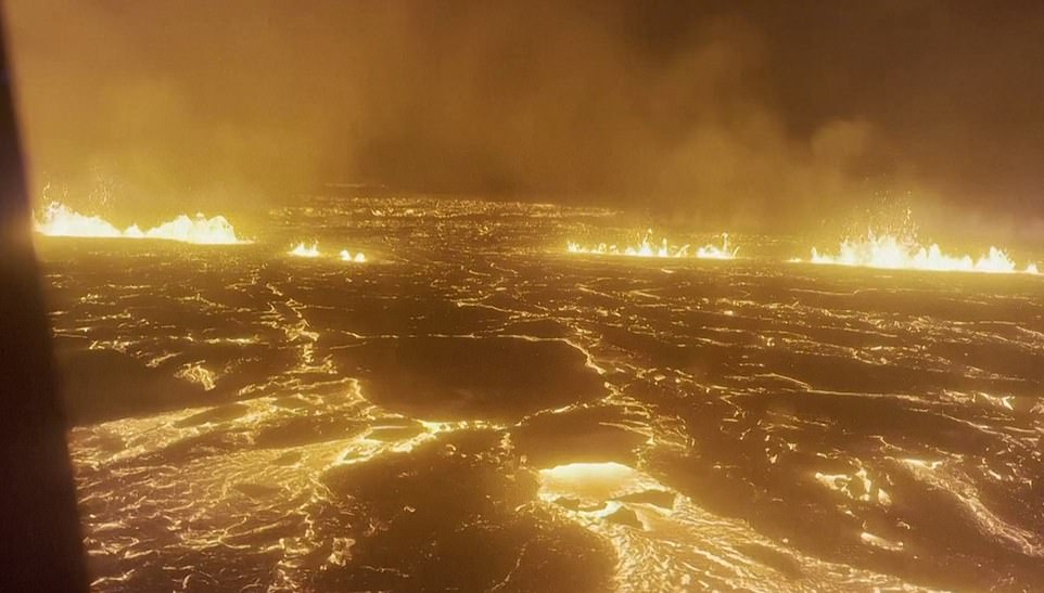 Stunning footage shows rivers of magma flowing across the land and the flame-filled sky in a spectacular show of the Earth's power in the land known for fire and ice