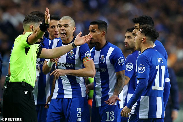 Porto players are outraged after referee Istvan Kovacs lets Shakhtar's equalizer stand