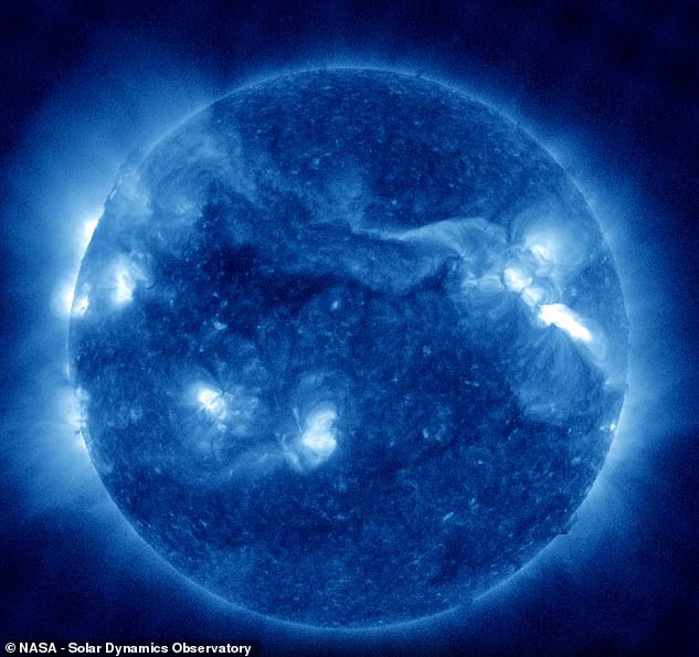 The Sun has just exploded with its largest solar flare in six years, and the bright flash of activity can be seen at the top right of this image