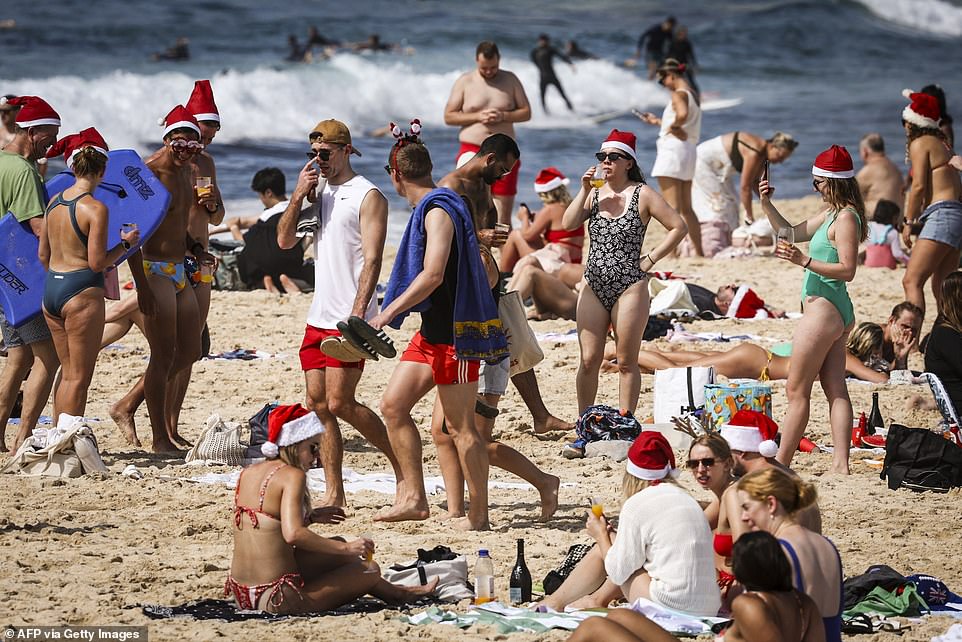 Santa hats were spotted in the sand at Bondi Beach on Monday