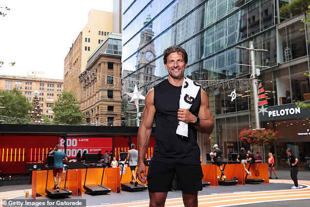 The Bachelor star, 40, was at the launch of Australia's first ever currency store in Sydney.  Tim showed off his huge biceps in a black shirt and shorts