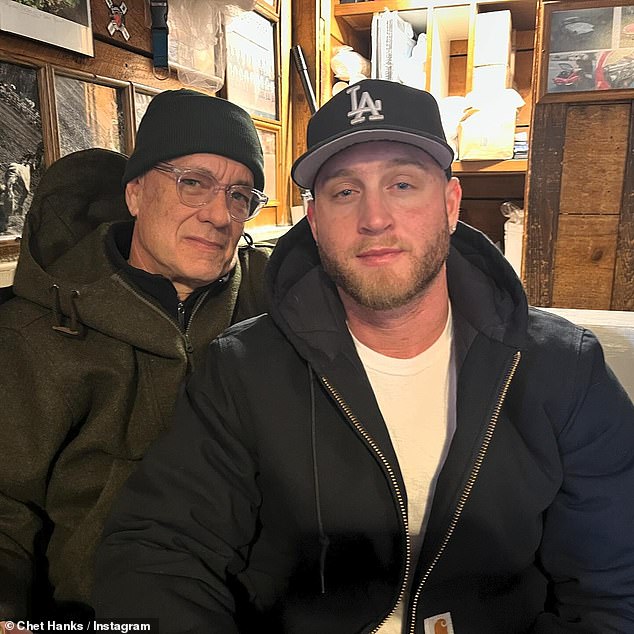 Chet Hanks, 33, shared a rare photo of himself posing next to his famous father Ton Hanks, 67, as the pair wear similar attire