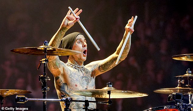 Travis Barker, 48, sold a pair of his blood-stained Vans sneakers and Dickies pants — which he wore on stage during his last tour — for a total of $10,000 during a recent online sale;  May seen