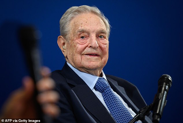 Hungarian-born American investor and philanthropist George Soros looks on after speaking on the sidelines of the World Economic Forum