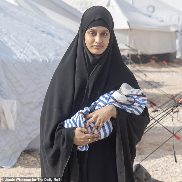 British jihadist woman Shamima Begum pictured with her one-week-old son Jerah at the Al Hawl camp for captured ISIS women with children, Kurdish Syria.  Not dated