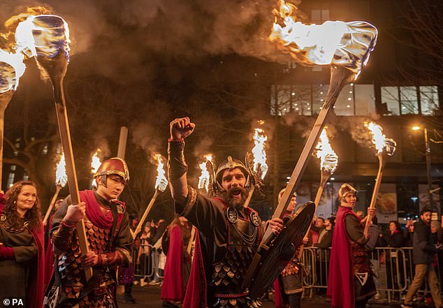 The Up Helly Aa Jarl team from the Shetlands donned their armor and marched 'the river of fire' through the streets of Edinburgh