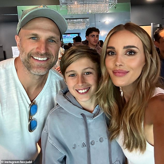 AFL WAG Rebecca Judd joined husband Chris and their 12-year-old son Oscar for the Australia vs Pakistan cricket test on Tuesday (all pictured)