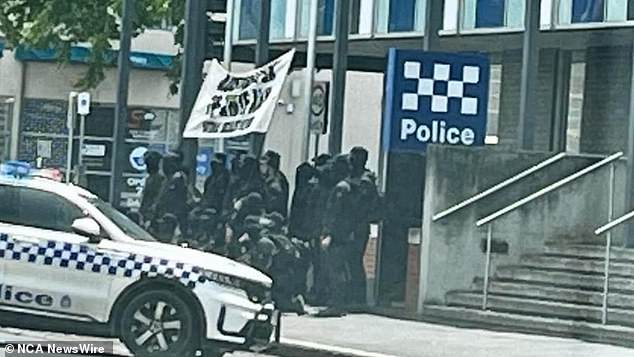 The neo-Nazi group was also seen posing and taking photos in front of the Ballarat police station