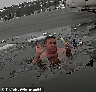 Erik Fellman, 38, enjoys a dip in a partially frozen lake just outside Stockholm all year round and documents his swims on TikTok