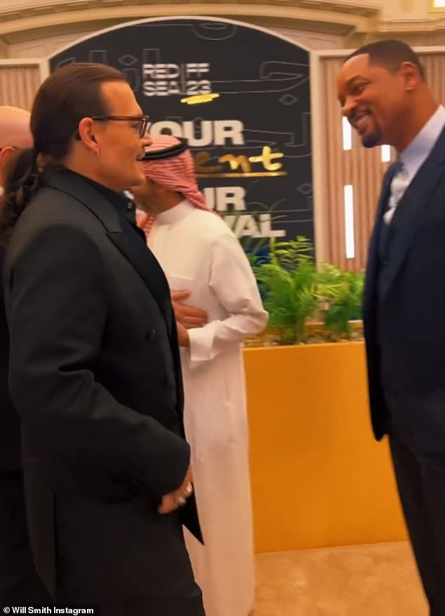 Will Smith, 55, shared a friendly hug with fellow Hollywood star, Johnny Depp, 60, as the pair attended the star-studded Red Sea International Film Festival in Jeddah, Saudi Arabia.