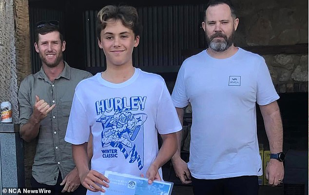 Locals are shattered after the death of teenage surfer Khai Cowley (pictured centre), who was mauled by a suspected great white shark