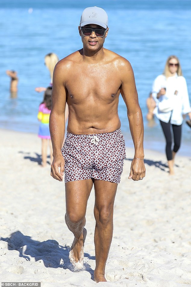 The Baton Rouge, Louisiana native donned a vintage patterned swimsuit, gray ball cap and sunglasses on the wintery day in the sunny location