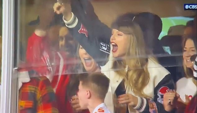 Swift celebrated the Chiefs' win with a drink in her hand and with a young Chiefs fan in a suite