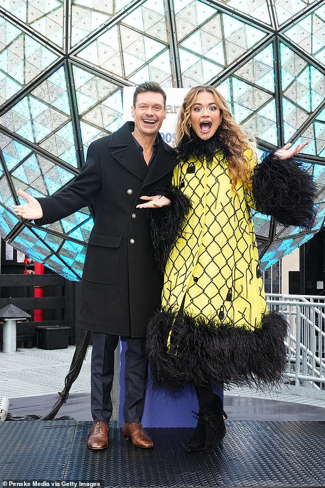 Rita made sure she turned heads in a vibrant yellow jacket that was dramatically trimmed with black faux fur around the collar and cuffs