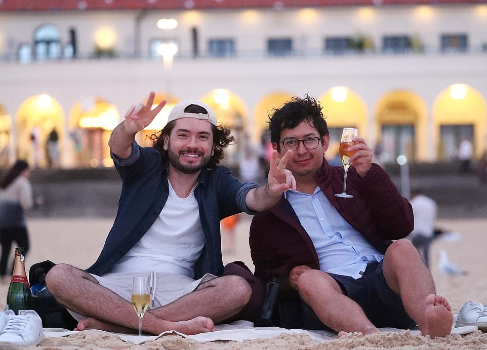 Others preferred to drink champagne from a glass while sitting on the sand and watching the first sunrise of 2024