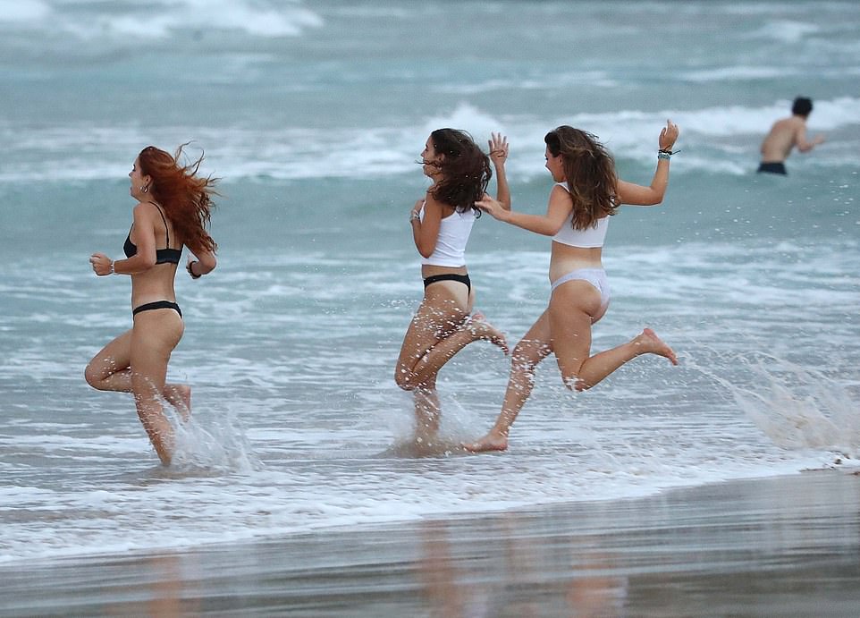 Among the revelers at Bondi Beach from first light were the cheerful, some taking an early morning dip in their underwear