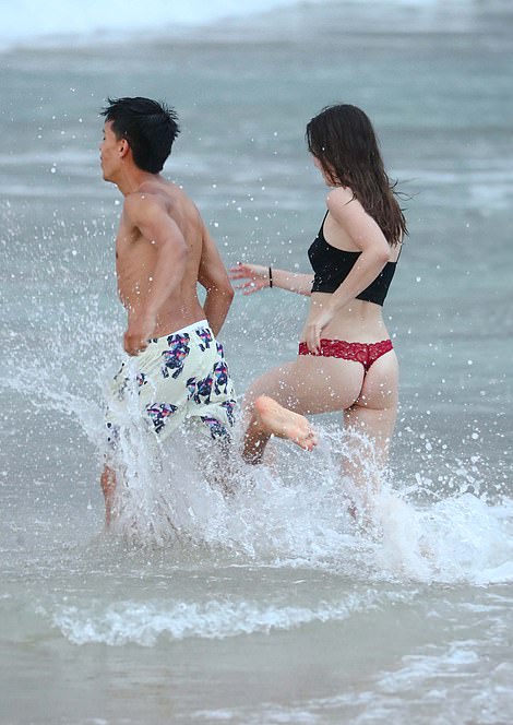 Other beachgoers ran straight into the cold water as they celebrated the start of 2024