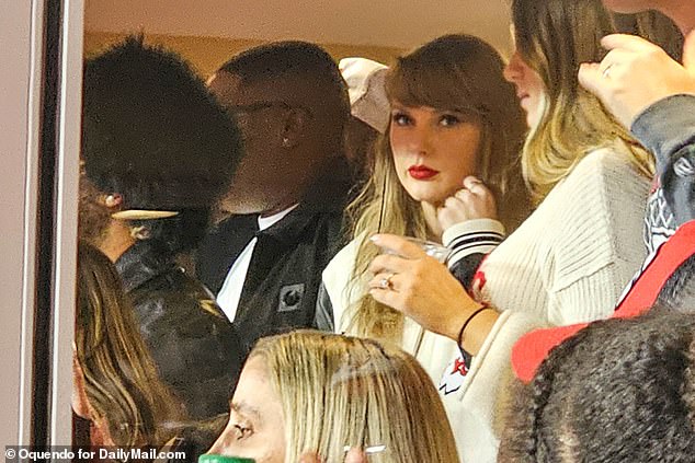 Taylor Swift glances into the crowd during Sunday's Chiefs-Bengals game in Arrowhead