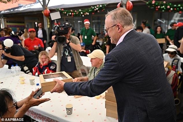 Australians are feeling the pressure now more than ever.  The Prime Minister helped serve a free Christmas lunch on December 25