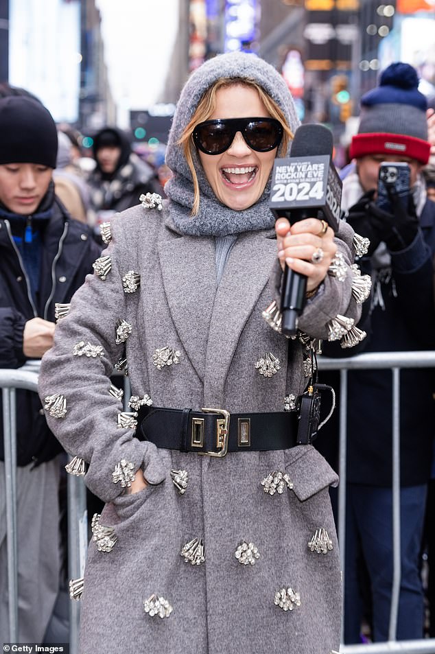 Rita was seen arriving as host earlier in the day wearing a gray coat with stone tassels all over