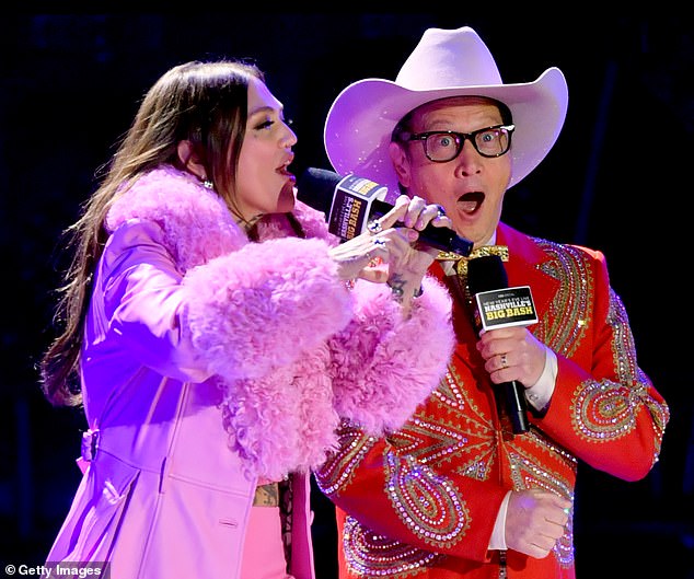 The beautiful singer added a pink jacket with fur trim to her stylish mix before bringing a special guest on stage: her son Lucky