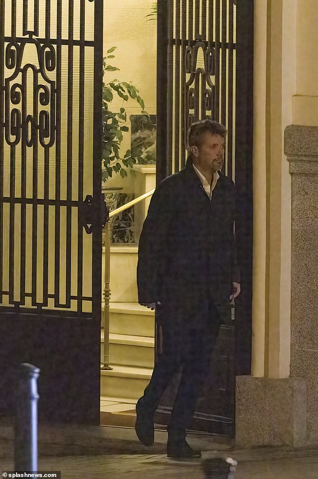 Frederik is seen leaving Genoveva's apartment complex before going to dinner.  It looks like he has changed from a navy blue jacket and brown trousers to a white shirt and dark trousers with a neat dark jacket