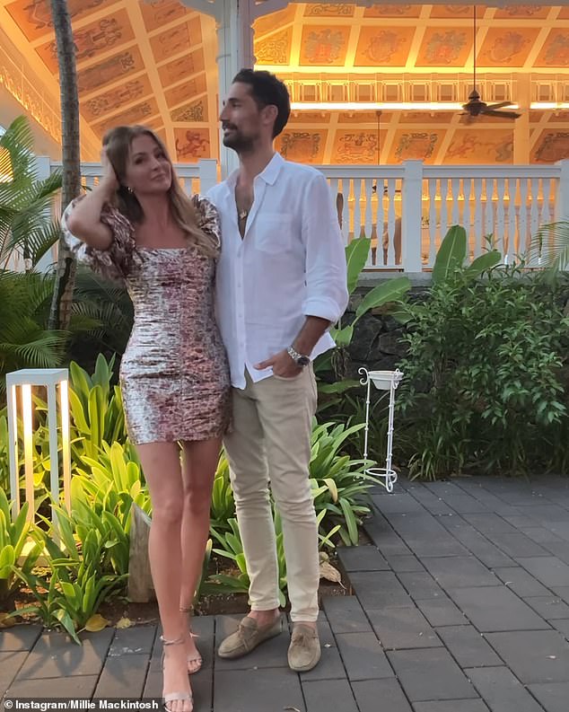 Millie put on a leggy show in a mini dress with floral puff sleeves paired with strappy sandals as she posed with her former Made In Chelsea co-husband