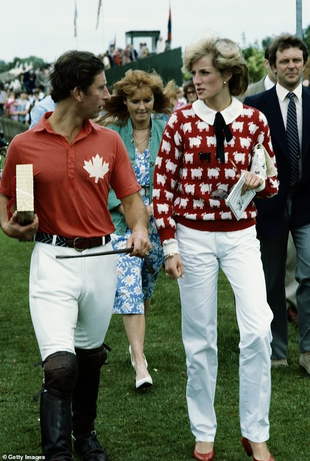 Prince Diana in her 'black sheep' sweater walks with Prince Charles at a polo meeting in Windsor, June 1983